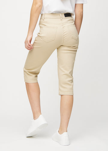Beige regular capris seen from the back, so the full product can be seen.