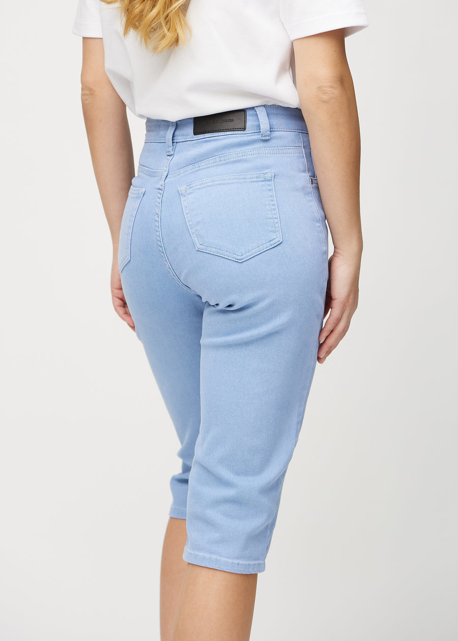 Light blue regular capris seen from the back close up to show details.