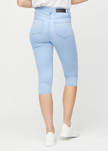 Light blue skinny capris seen from the back, so the entire product can be seen.