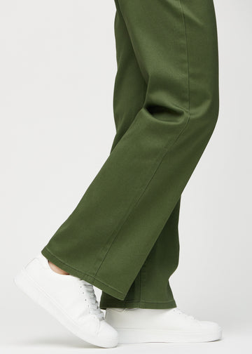 Loose jeans for women in dark green, color Renewals. Close-up at the ankles on a model, showing the wide leg openings.