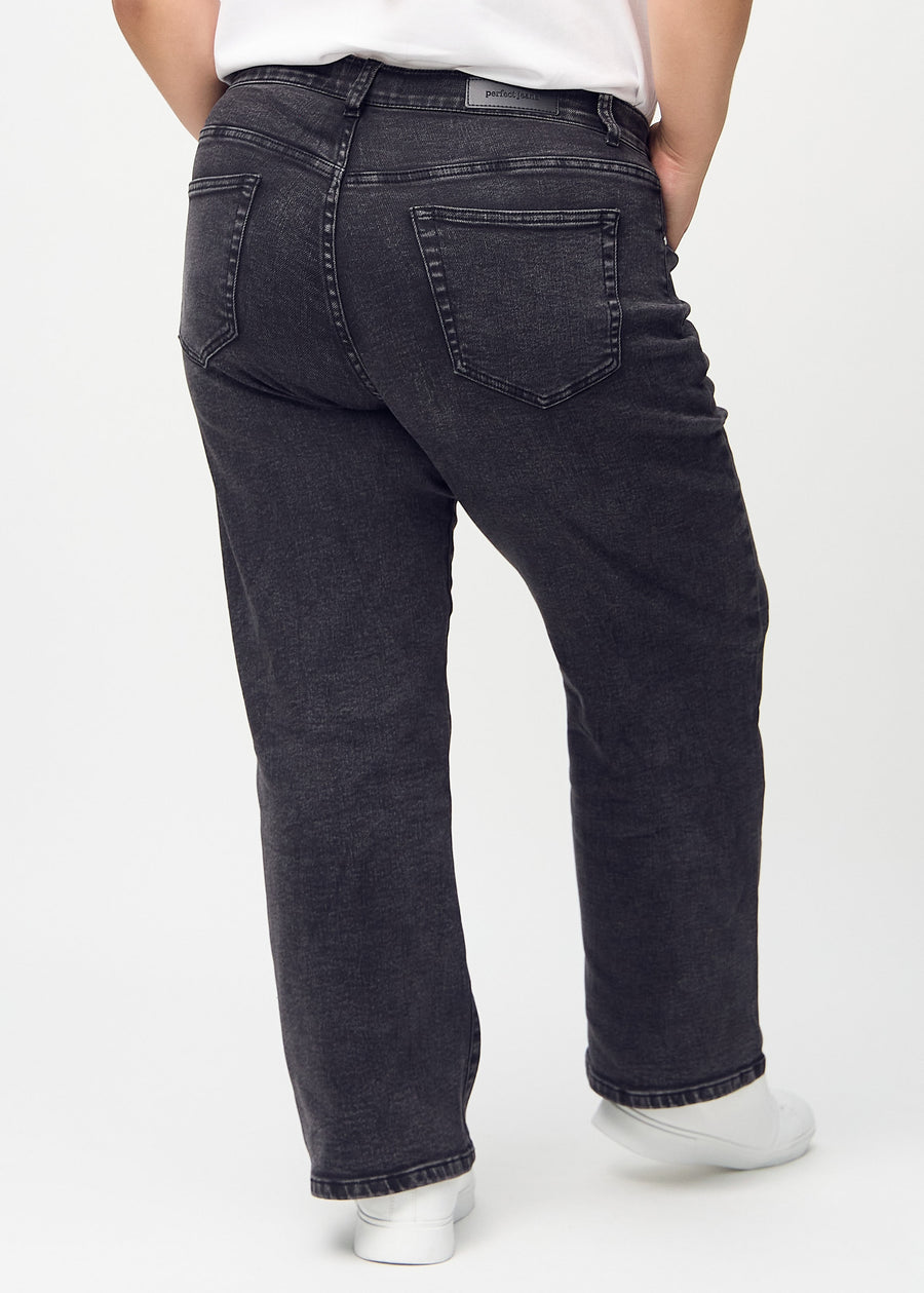 Dark grey denim loose jeans seen from the back on a plus-size model, so the entire product can be seen.