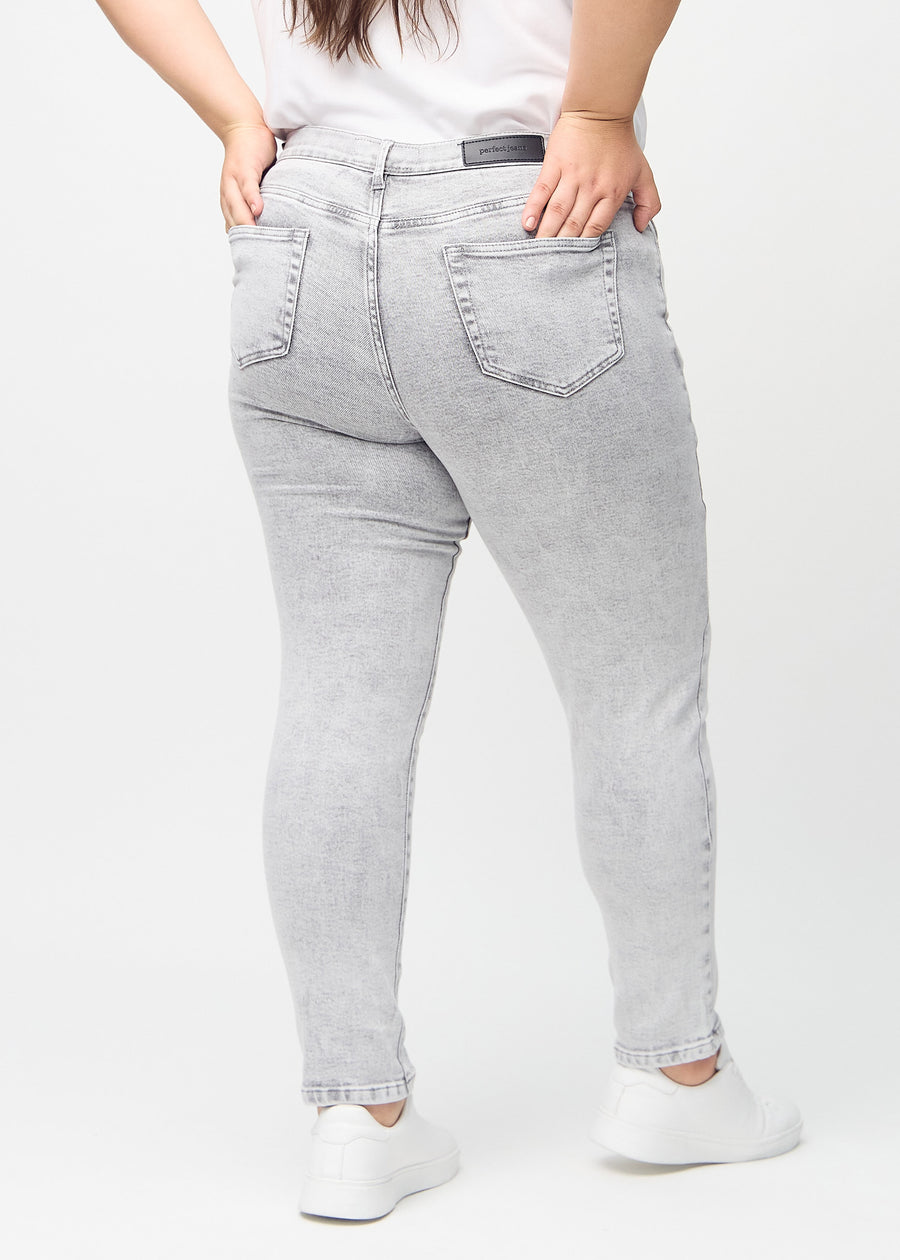 Slim jeans for women in light grey, color Ashes. Back view on a plus-size model, showing the overall fit.