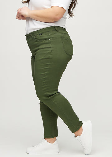 Slim jeans for women in dark green, color Renewals. Side view on a plus-size model.