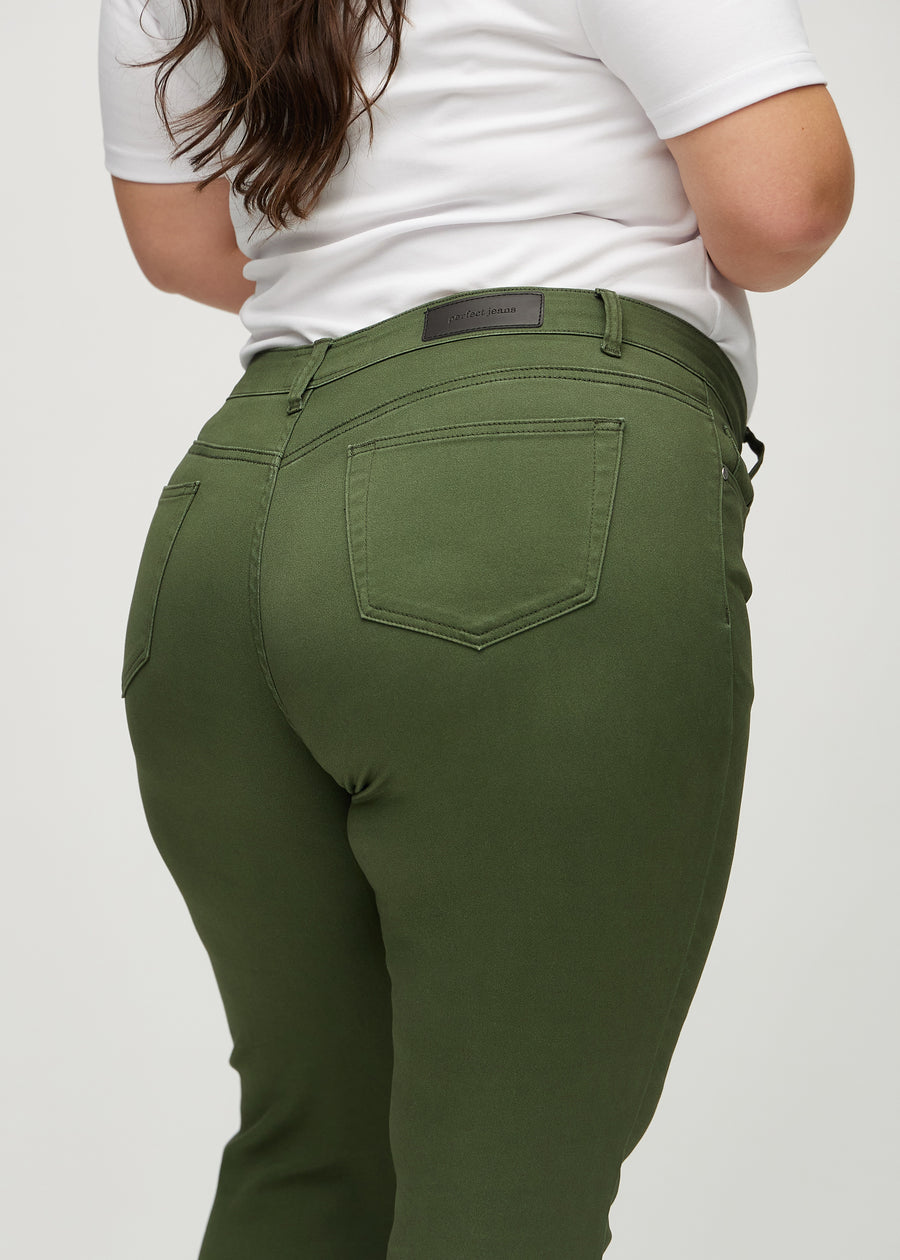 Slim jeans for women in dark green, color Renewals. Close-up back view on a plus-size model, showing the details.