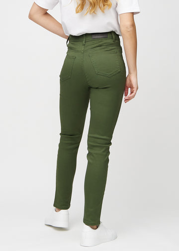 Slim jeans for women in dark green, color Renewals. Back view on a model, showing the overall fit.
