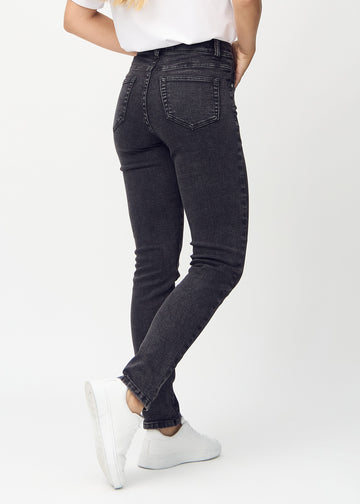 Slim jeans for women in dark grey, color Shadows. Back view on a model, showing the overall fit.