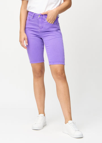 Purple skinny middle shorts, style name Lavenders, which fit closely around the thigh and end just above the knee, seen from the front.