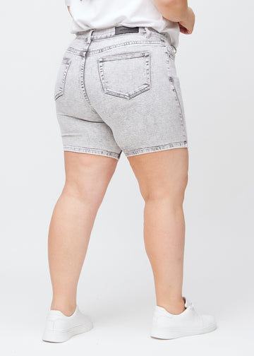 woman in light grey denim shorts
