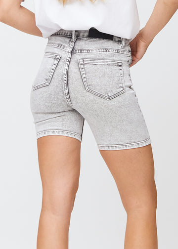 Light grey denim skinny short shorts seen from the back in close-up to show details.