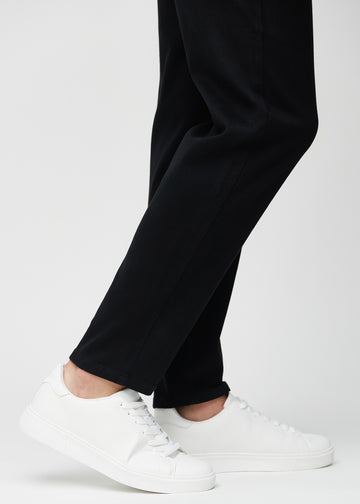 The ankles of a model, so you can see how loose the jeans fit.