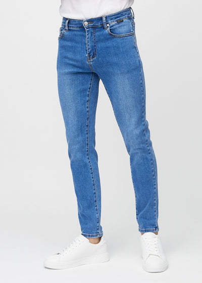 Blue denim slim jeans, model name Rivers, fitted closely along the legs , front view.